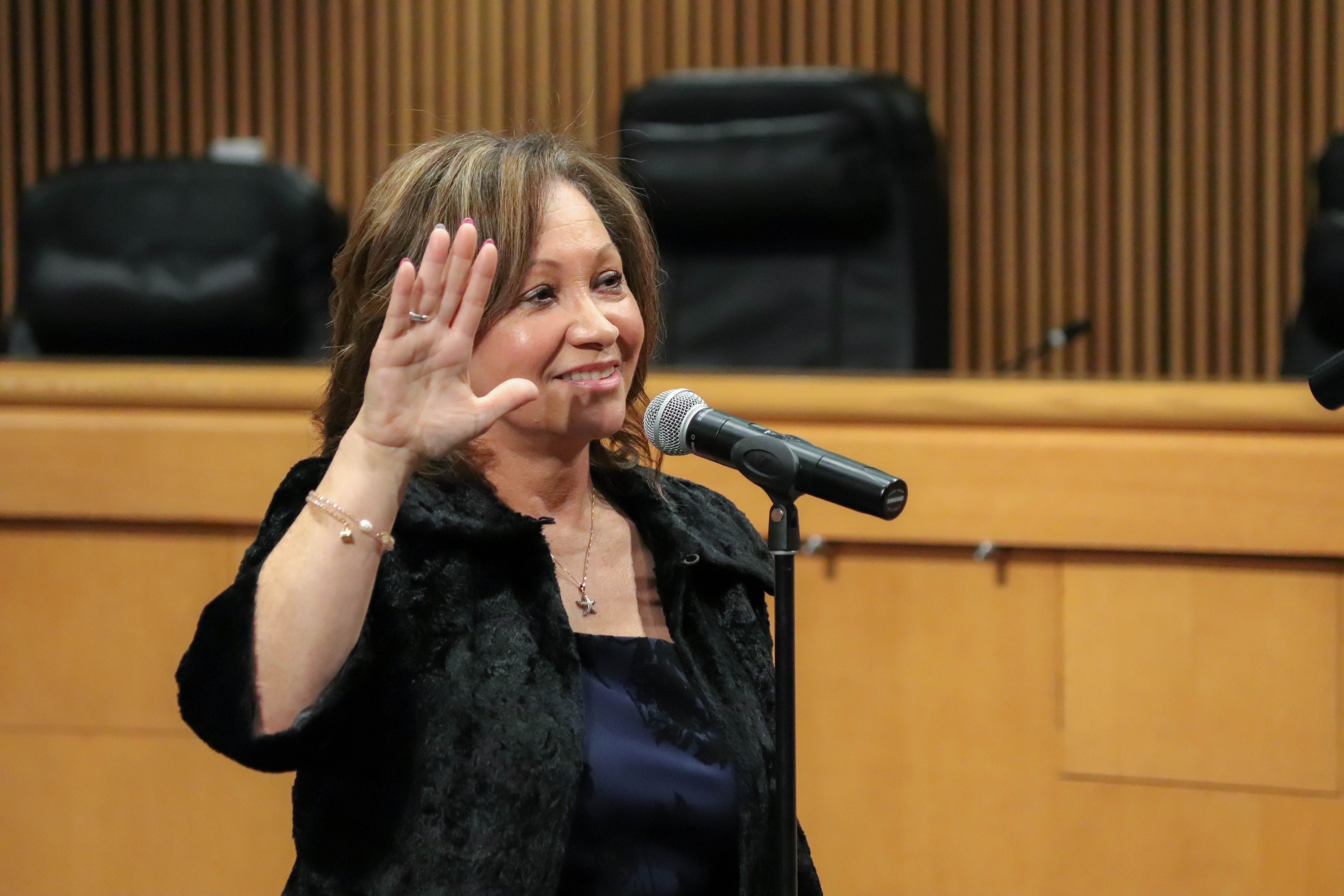 Tax Commissioner Denise R. Mitchell with her right hand raised as she is being sworn into office